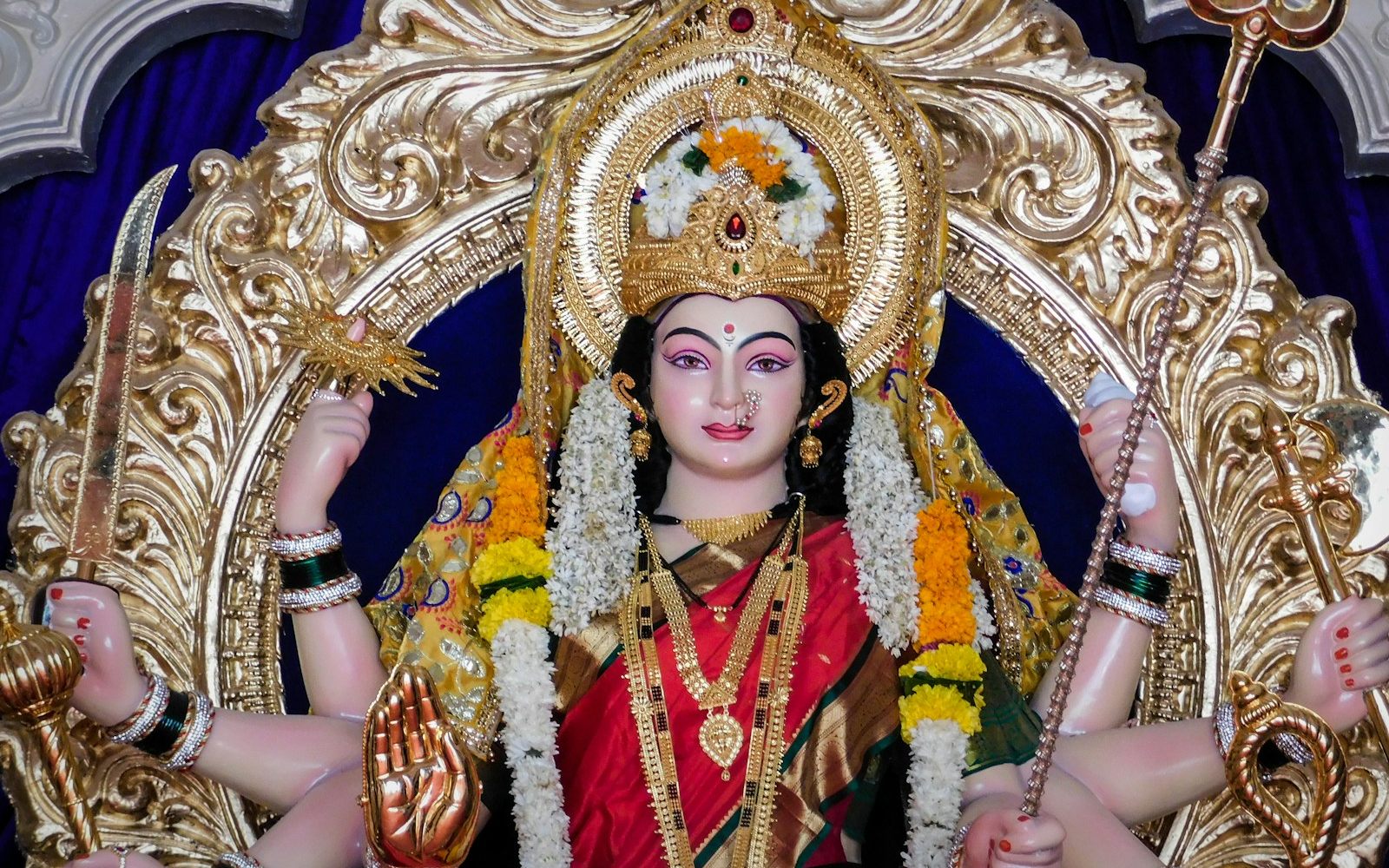 A decorated idol of the Goddess with marigold garlands during Navratri