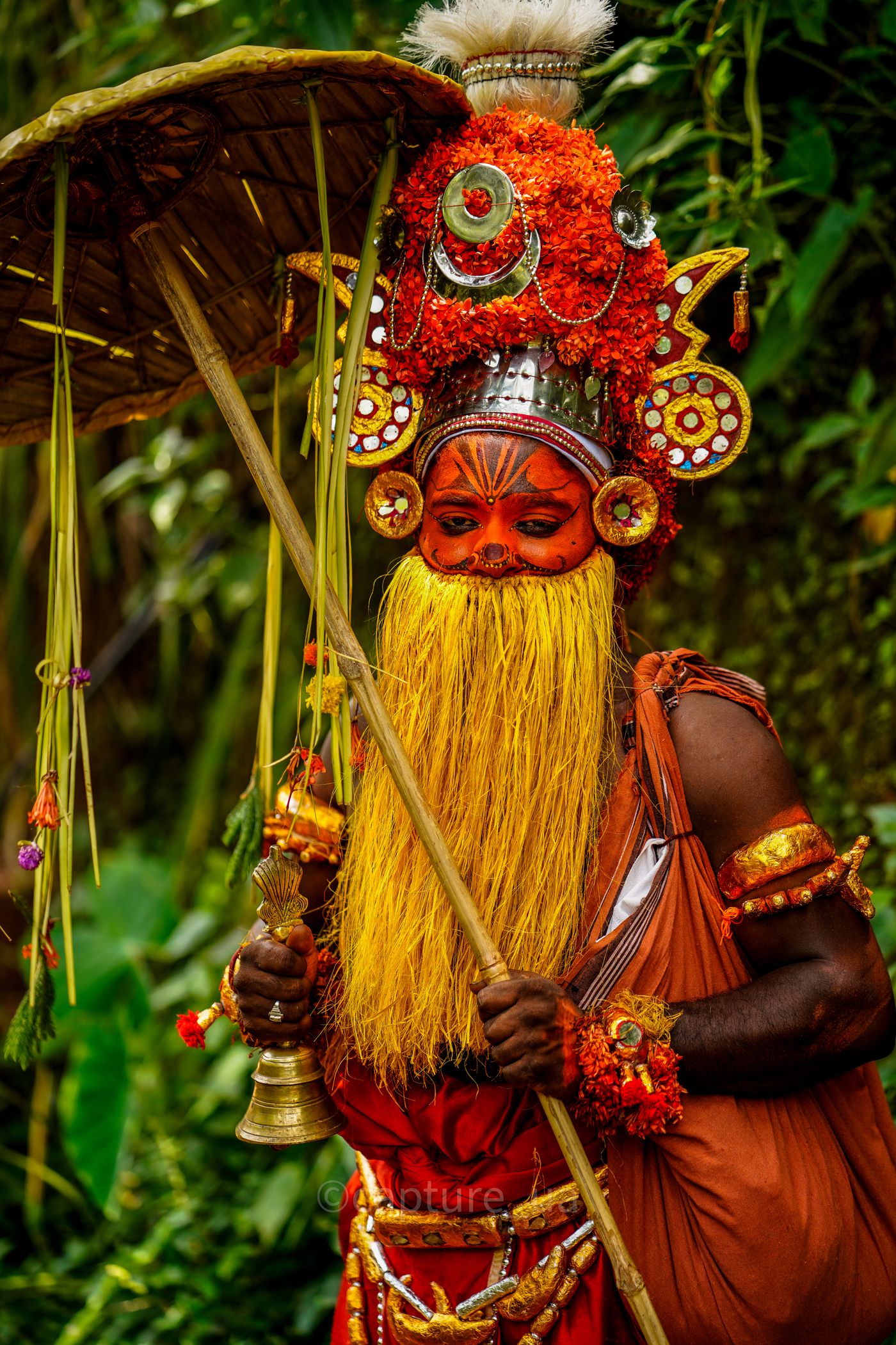 Performer in colourful traditional costume during Onam celebrations in Kerala
