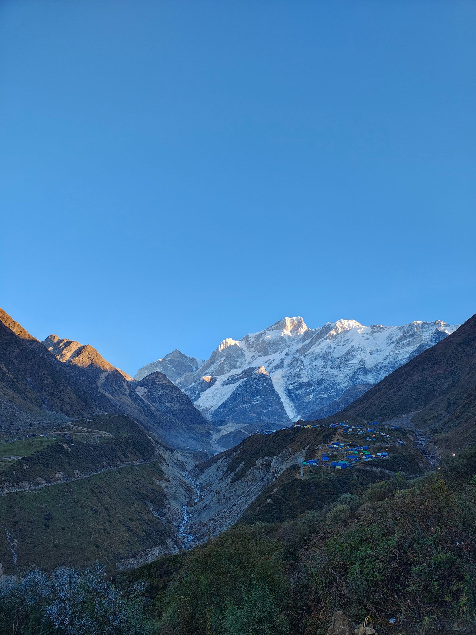Himalayan peaks over a temple on the Char Dham circuit, Uttarakhand